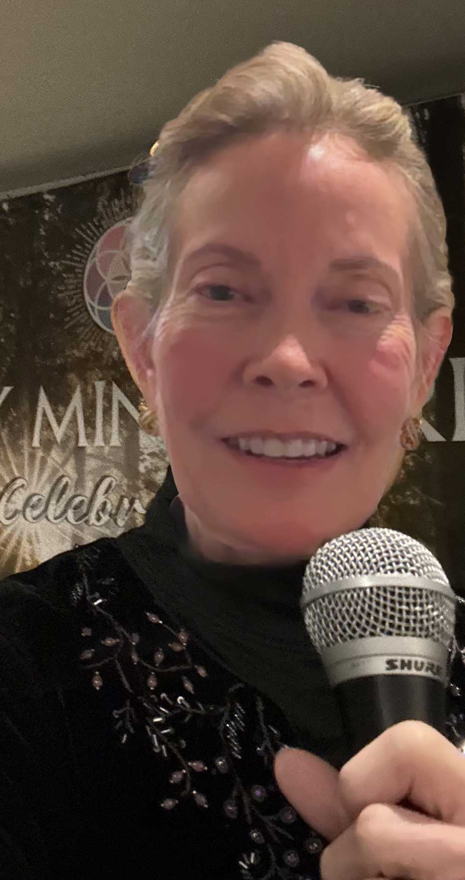 Robyn Locke speaking with microphone